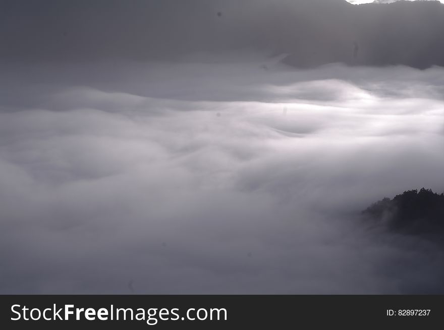 Scenic view of a white cloudscape over mountain range.