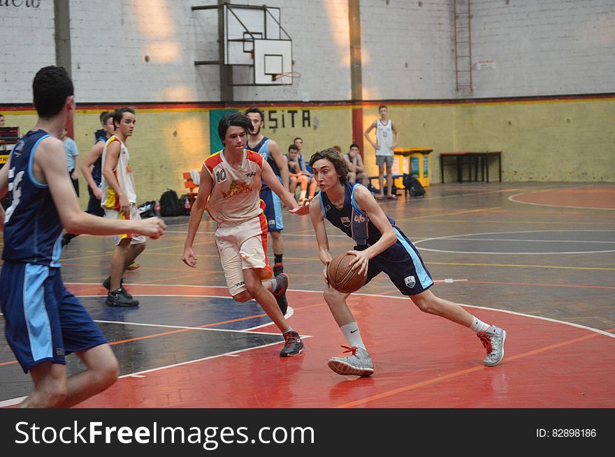 Athletes In Basketball Game