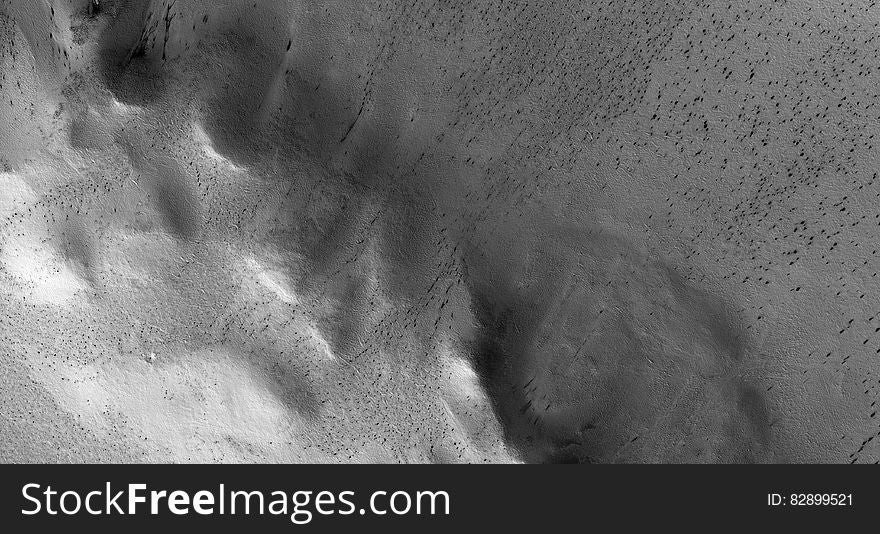 Monochrome photo of a bleak, rocky landscape on Mars.