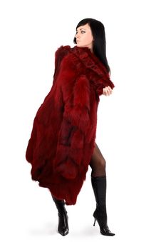 Brunette Is In A Red Fur Coat Royalty Free Stock Image
