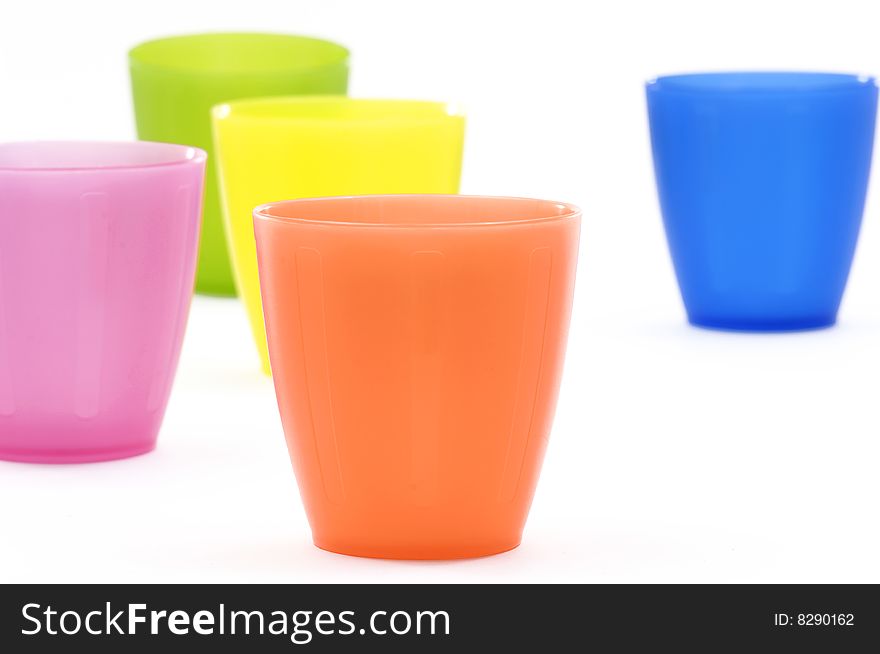 Colorful plastic cups and dish