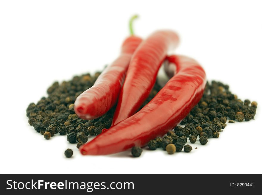 Black and red pepper on a white background