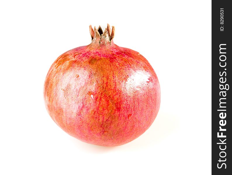 Ripe pomegranate on white ground