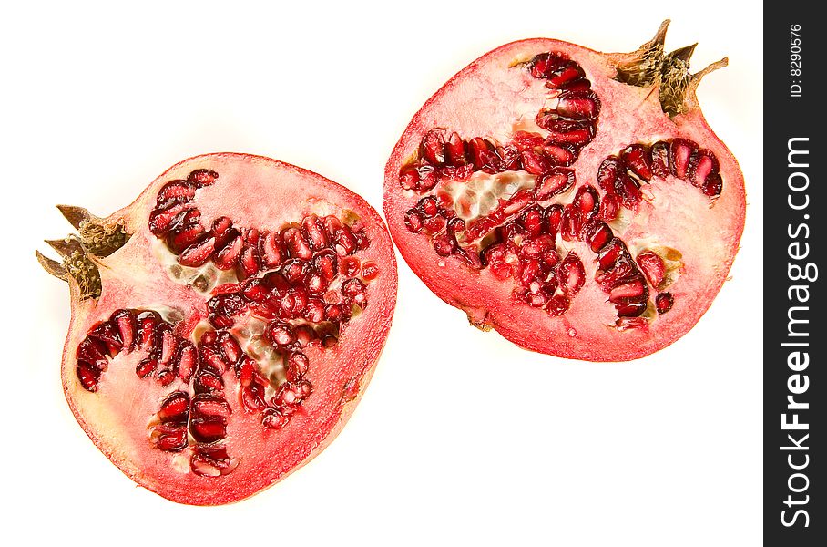 Ripe pomegranate on white ground