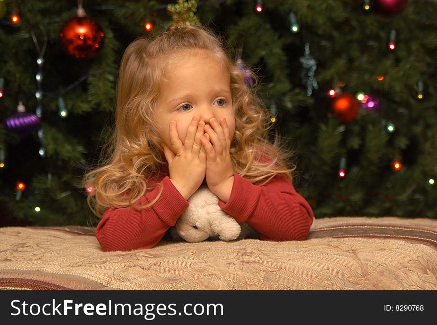 A two-and-a-half year old girl tests out her own poses and expressions in front of the camera while having her portrait taken. A two-and-a-half year old girl tests out her own poses and expressions in front of the camera while having her portrait taken.