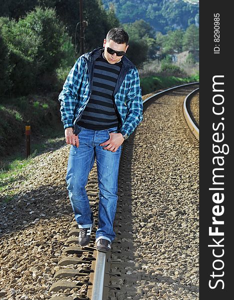 Man walking on a railway. Man walking on a railway