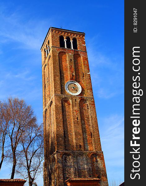 An old, brick made clock tower. An old, brick made clock tower