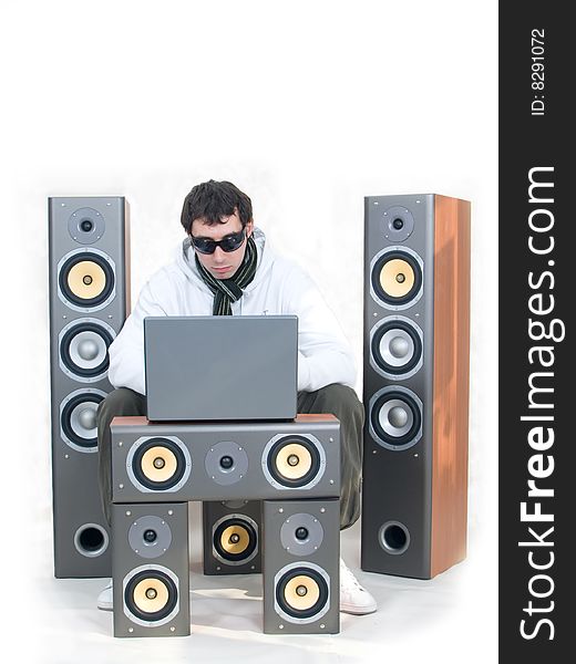 Speakers with yellow bass, laptop and dj. Speakers with yellow bass, laptop and dj