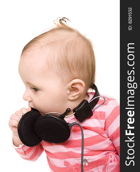 Baby with headphones on white