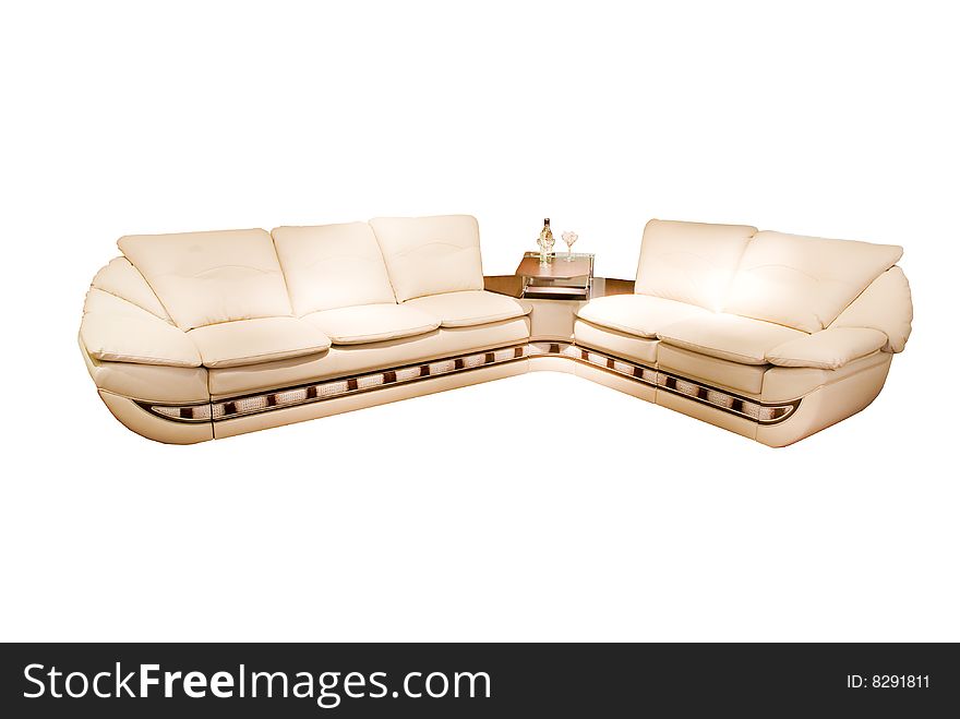 Leather beige angular modern sofa over white background