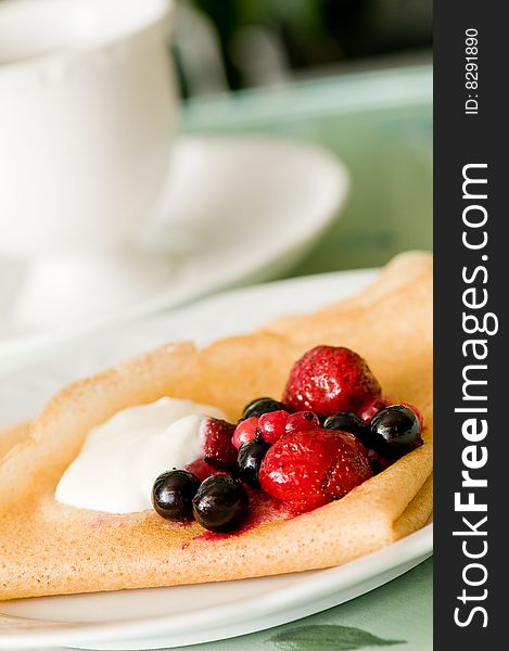 Tasty breakfast from pancake with berry