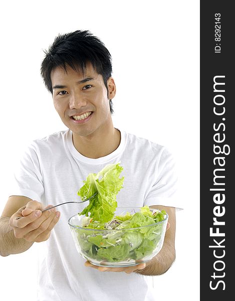 Young man holding fresh salad. Young man holding fresh salad
