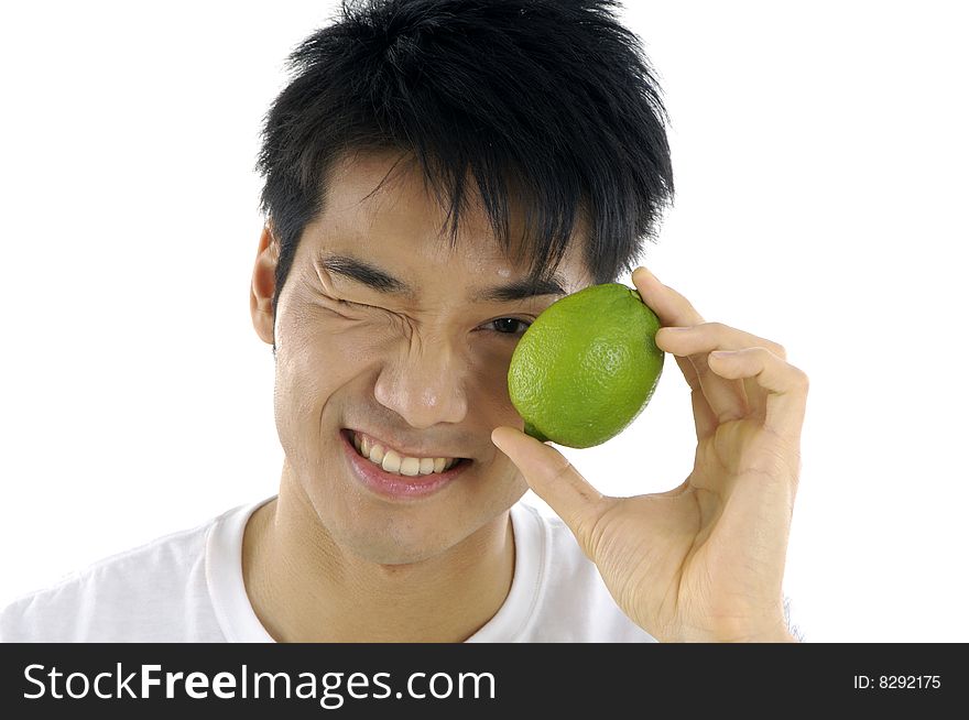 Young man holding fresh lemon. Young man holding fresh lemon