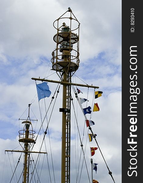 The crow's nest and light mast of an older ship.