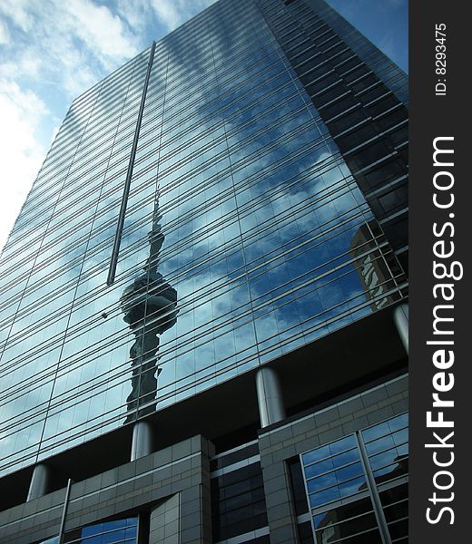 Reflection of the Cn Tower in Toronto in a modern highrise. Reflection of the Cn Tower in Toronto in a modern highrise