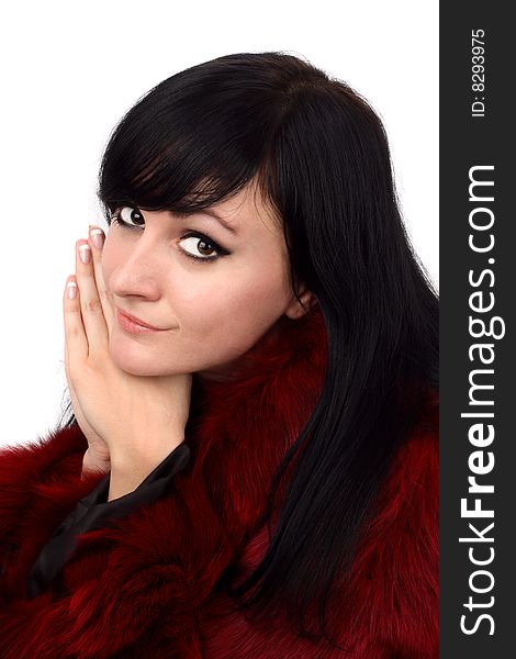 Brunette is in a red fur coat