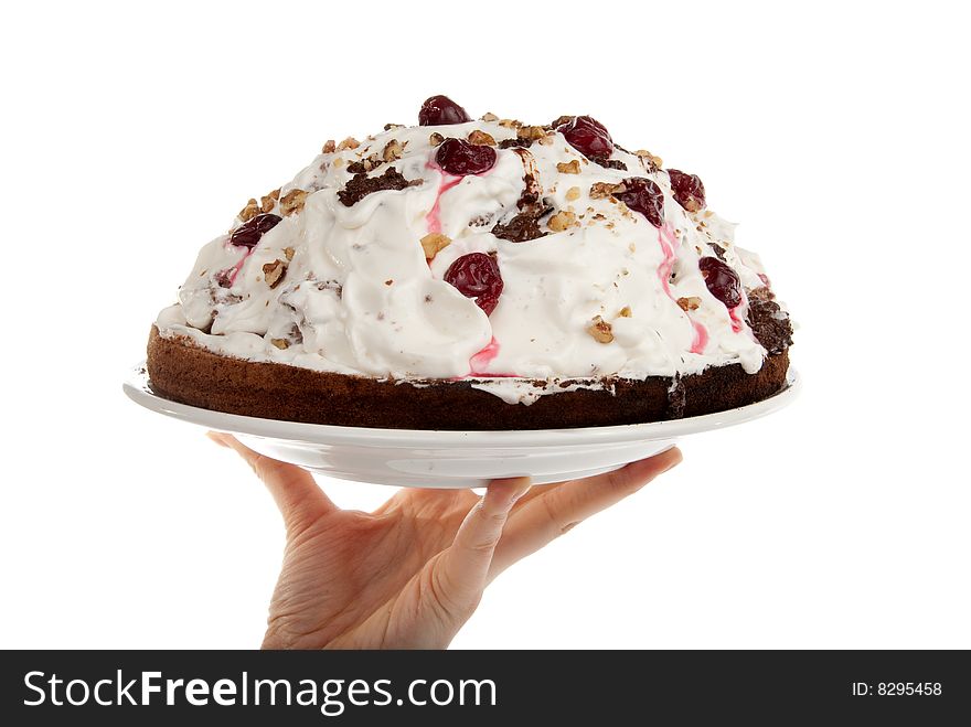 Homemade cake in the hands isolated over white