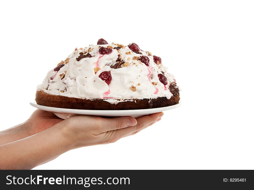 Homemade cake in the hands isolated over white