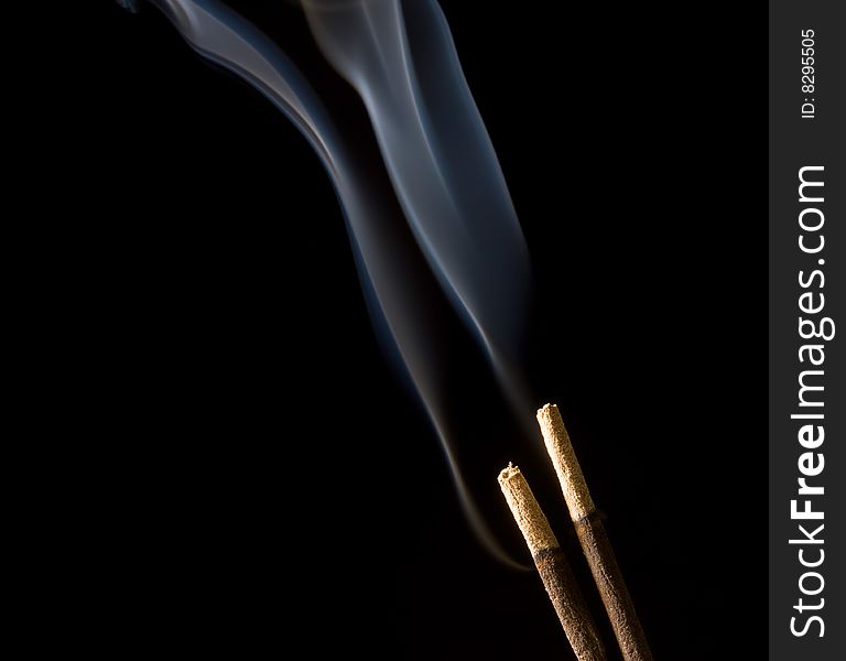 Two sticks and smoke .Isolated on black. Two sticks and smoke .Isolated on black.