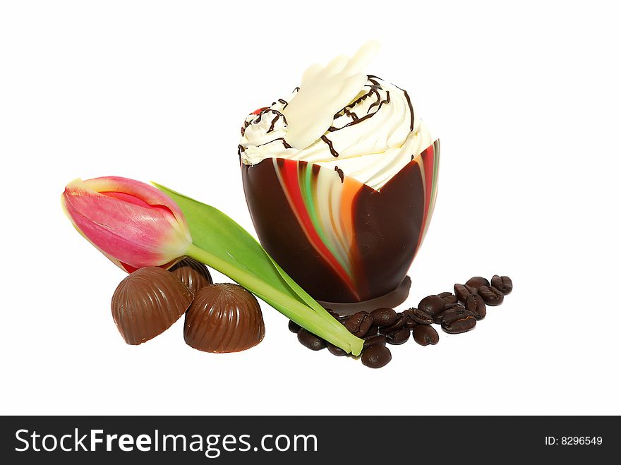 Amazing desert is chocolate coffee egg desert with sweets and pink tulip  isolated on the white. Amazing desert is chocolate coffee egg desert with sweets and pink tulip  isolated on the white.