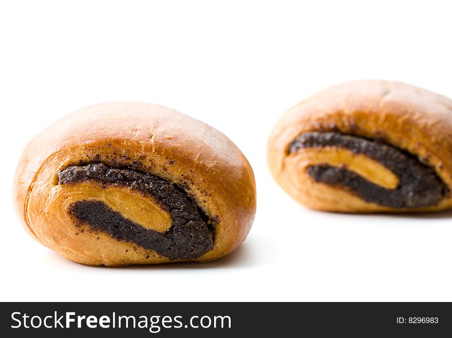 Two sweet buns with poppyseeds isolated on white. Two sweet buns with poppyseeds isolated on white