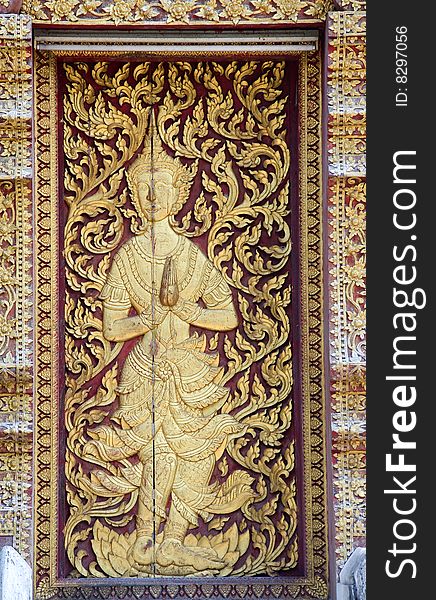 Thailand, The wat Jed Yod or  seven Peaks in the city of Chiang Mai is a sort of copy of the Mahabodhi temple in India; View of a door's decoration. Thailand, The wat Jed Yod or  seven Peaks in the city of Chiang Mai is a sort of copy of the Mahabodhi temple in India; View of a door's decoration