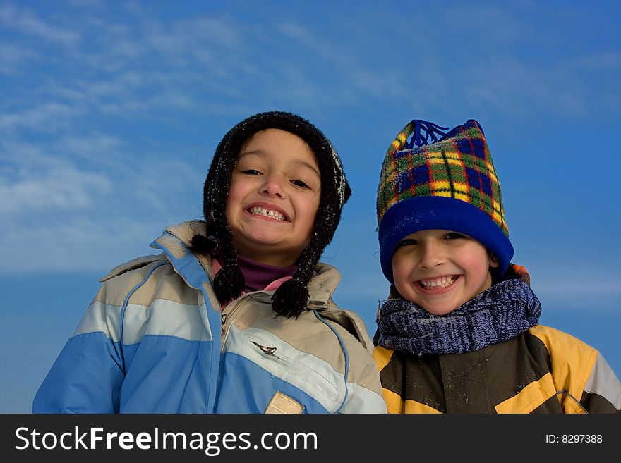 Cute girl and boy winter portrait