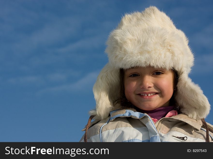 Smilling Girl Winter Portrait In The Fur-cap