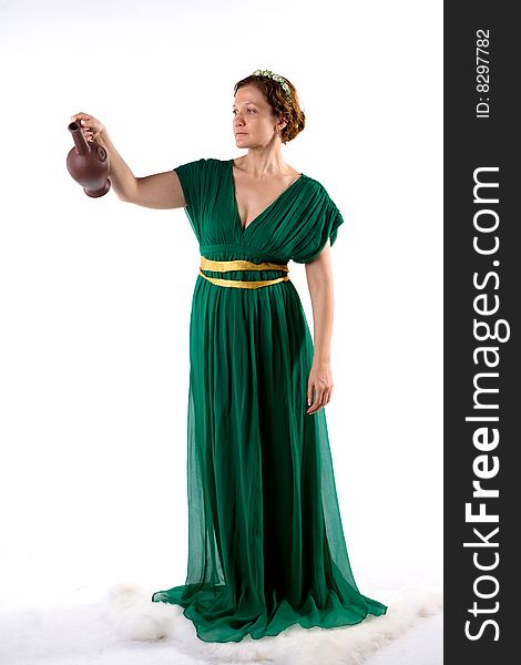 Lady in green antique dress handing jug on white background. Lady in green antique dress handing jug on white background