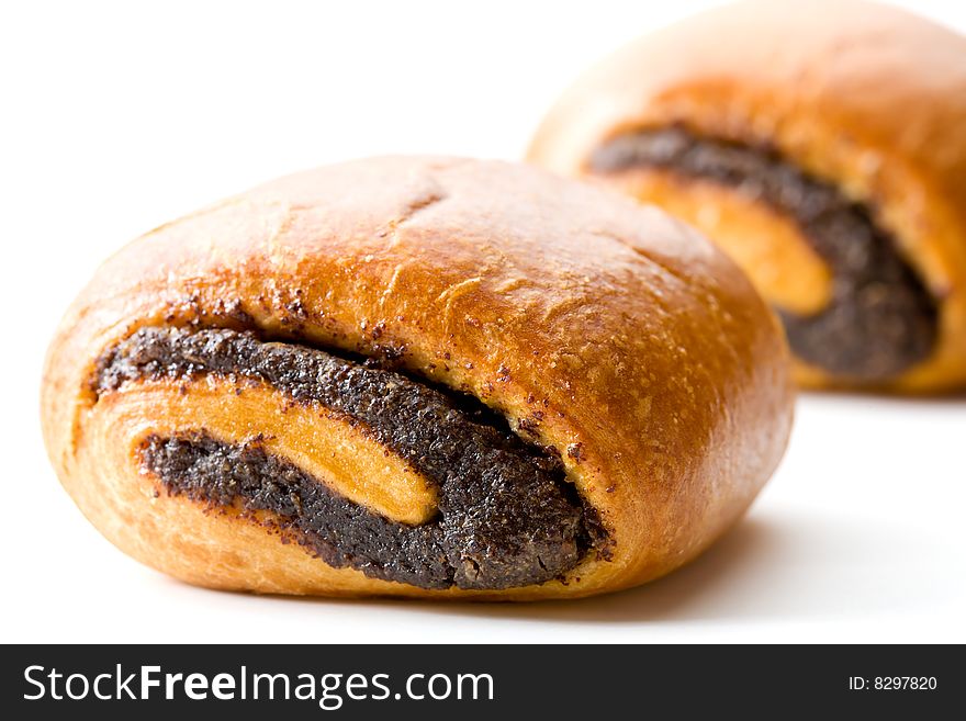 Two sweet buns with poppyseeds isolated on white. Two sweet buns with poppyseeds isolated on white