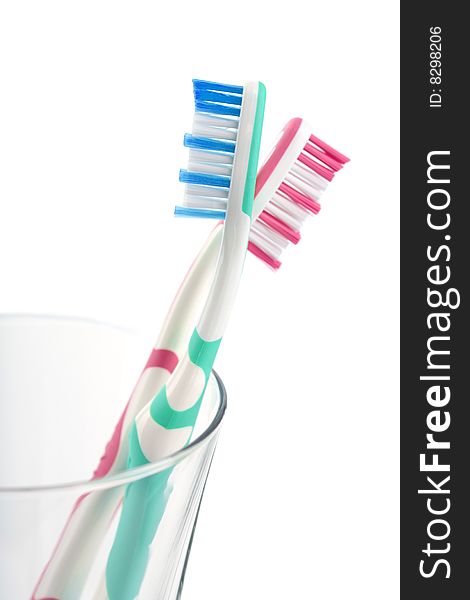 Two colorful toothbrushes isolated on white