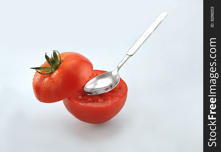 Tomato close-up isolated on white