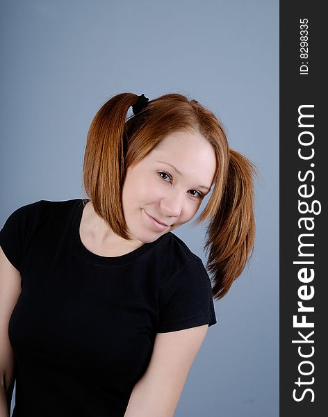 Portrait of a young beautiful woman with pigtail