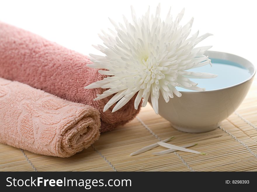 Towels and white flower isolated. spa and body care