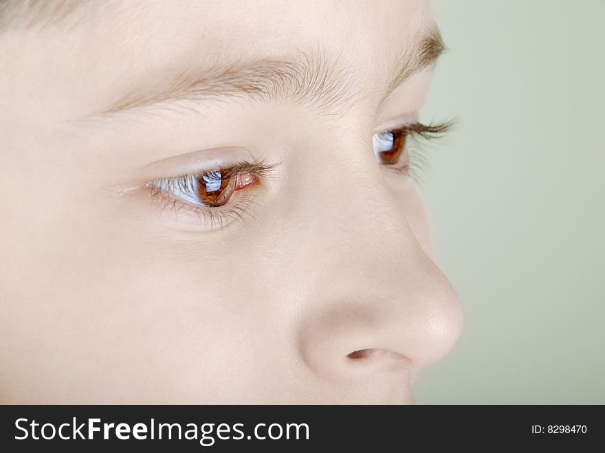 Boy face close-up. Big bright eye