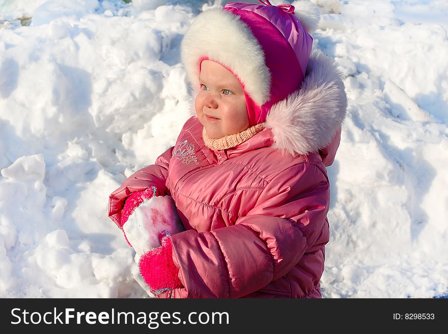 Pretty little girl in winter outerwear.