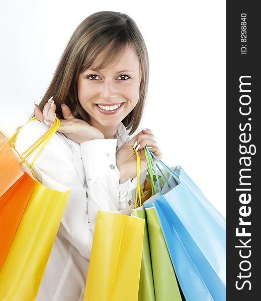 Portrait of an attractive young woman holding several shoppingbags. Portrait of an attractive young woman holding several shoppingbags.