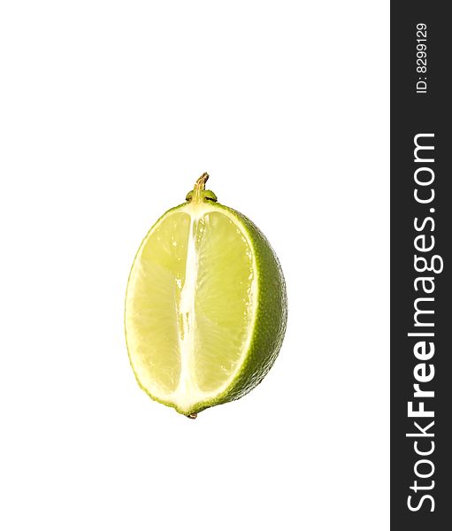 Lime cut in half towards white background. Lime cut in half towards white background