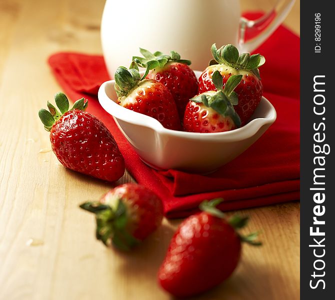 Fresh strawbeeries in a bowl and yogurt. Fresh strawbeeries in a bowl and yogurt