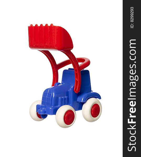Toy tractor towards white background