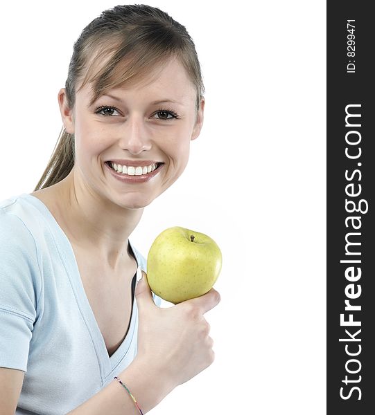 Beautiful young woman holding a green apple