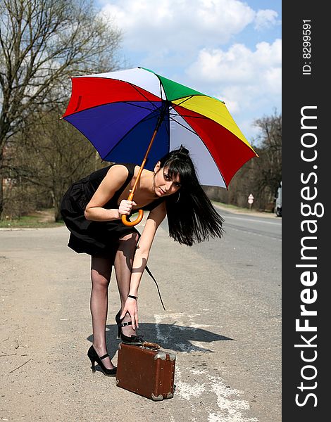 Girl with umbrella outdoors