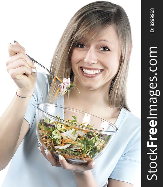 Portrait of young happy woman eating salad