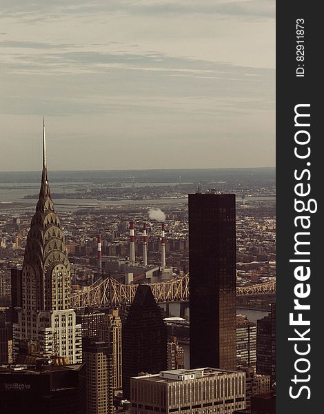 Aerial view of rooftops in modern city skyline.