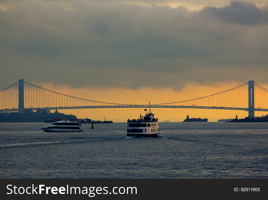 Bridge Over River At Sunset