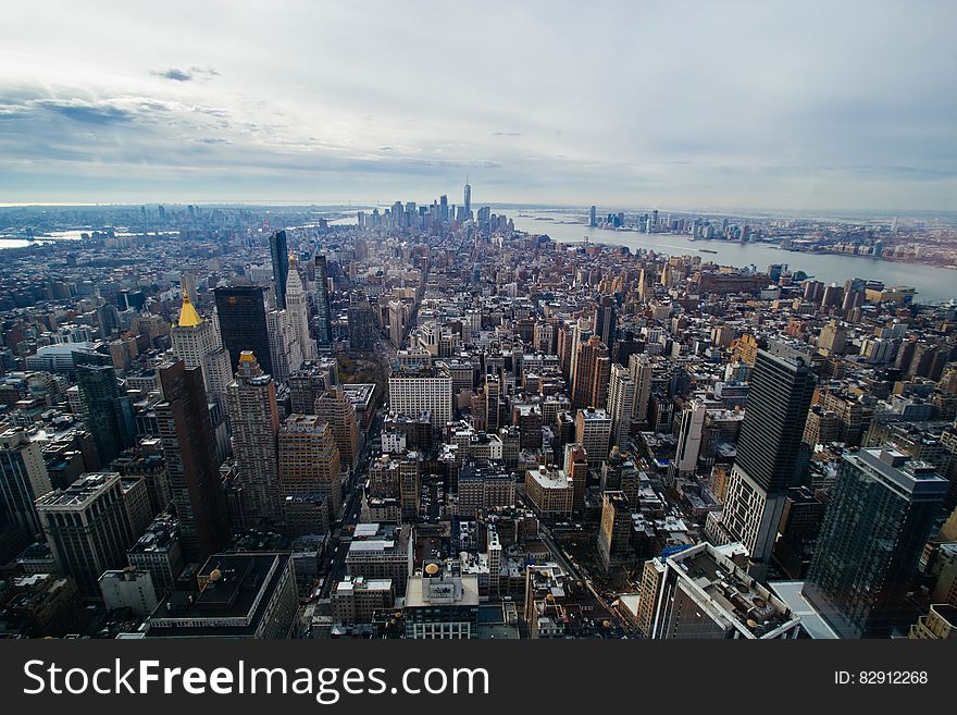 Aerial view over rooftops on Manhattan, New York along waterfront. Aerial view over rooftops on Manhattan, New York along waterfront.