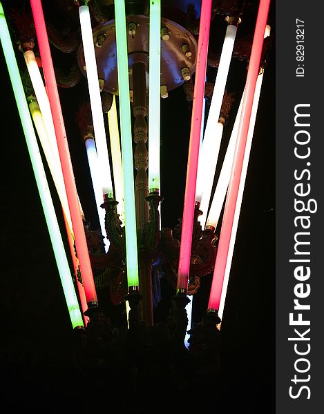 Colorful light sabers in ring.
