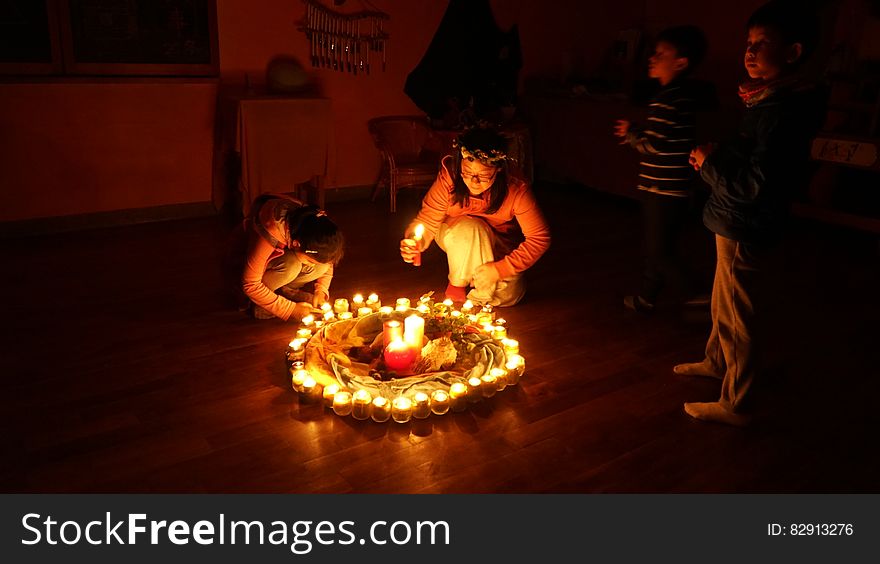 Children Lighting Candles In Circle