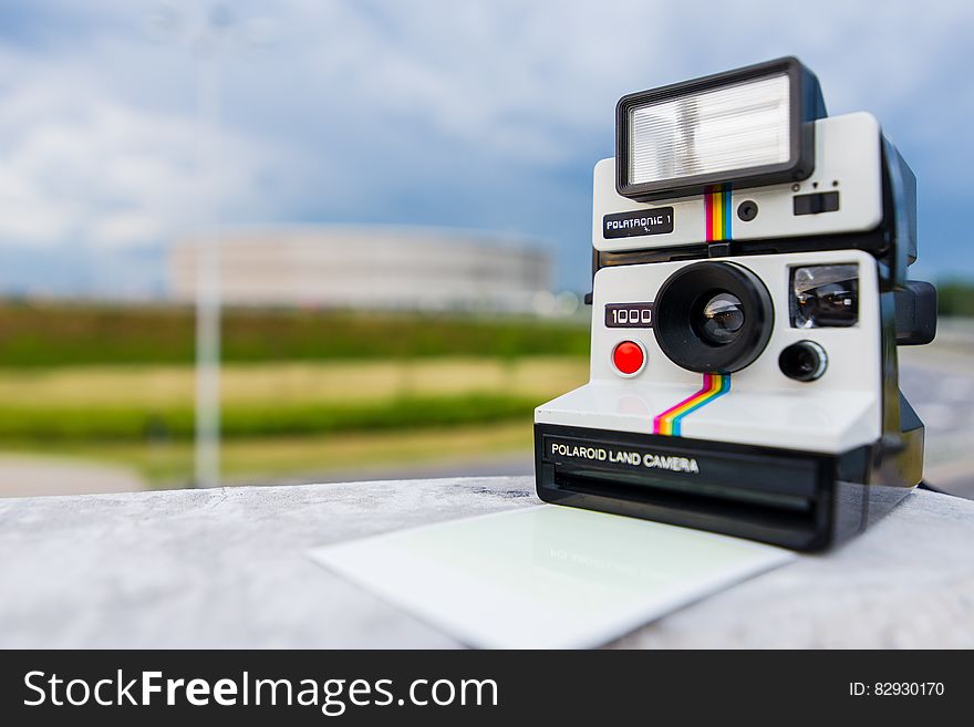 Tilt Shift Photography of Polaroid Land Camera on White Table