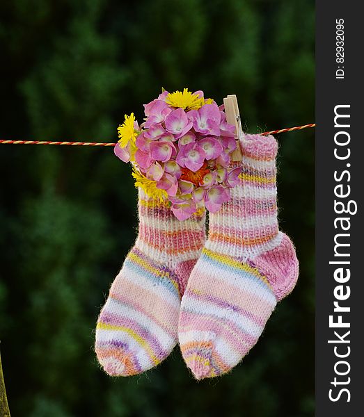Pink and White Sock With Pink Flower Hanging